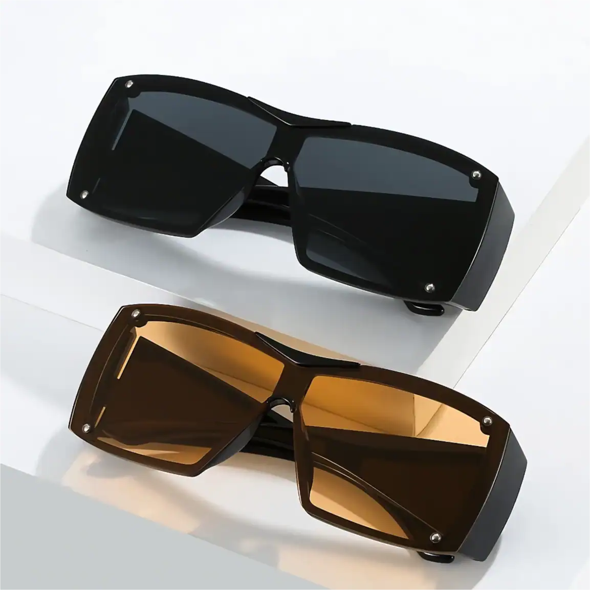 High-quality black and brown oversized sunglasses with UV protection, perfect for fashion-forward individuals seeking style and sun protection.