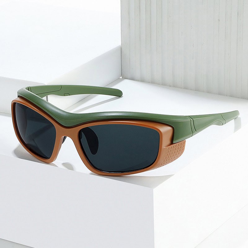 Stylish modern sunglasses with green and tan frame, dark UV-protected lenses for eye health, perfect for outdoor fashion and eye protection.