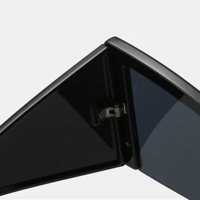 Smart foldable mirror with sleek black frame for modern optical diagnostics and aesthetic appeal.