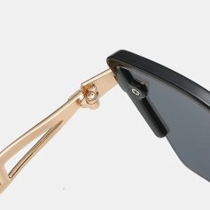 Close-up of stylish black glasses and black sunglasses connecting, showcasing high-quality optical products for vision correction and UV protection.