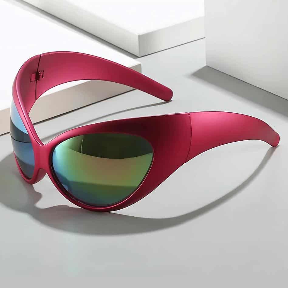 Stylish pink sports sunglasses with mirrored green lenses, perfect for outdoor activities and UV protection. Unique design offers comfort and eye health protection.