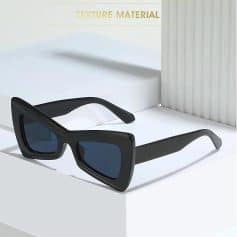 Stylish black sunglasses with large square frames perfect for eye protection and fashion statement. Ideal for all-day outdoor wear and UV protection.