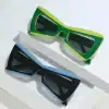 Stylish green and blue optical sunglasses for UV protection and fashion. Perfect for everyday wear, offering high-quality materials and modern design for ultimate eye protection and style.