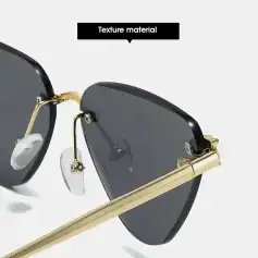 High-end black sunglasses with gold accents and textured details, perfect for stylish sun protection.