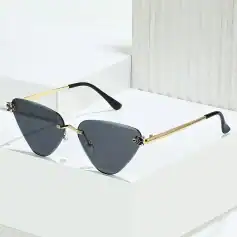 Luxury sunglasses with black tinted lenses, gold metallic arms, and sleek design, available at Monalisa Store for fashionable sun protection and statement style.