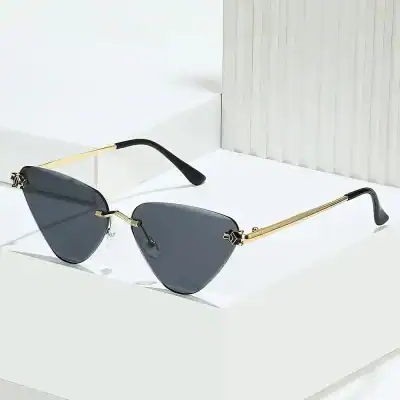 Luxury sunglasses with black tinted lenses, gold metallic arms, and sleek design, available at Monalisa Store for fashionable sun protection and statement style.