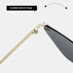 Close-up of a durable textured hinge on high-quality eyeglasses with a polished gold finish, designed for comfort and longevity.