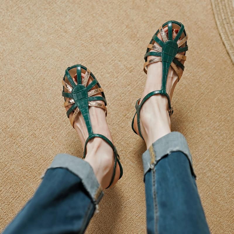 Close-up of women's fashionable green and metallic gold strappy sandals, perfect for summer or casual outings. Featuring comfortable heels and trendy design from Monalisa Medical Store.