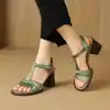 Stylish green open-toe sandals with ankle straps and chunky heels, perfect for summer and casual wear.