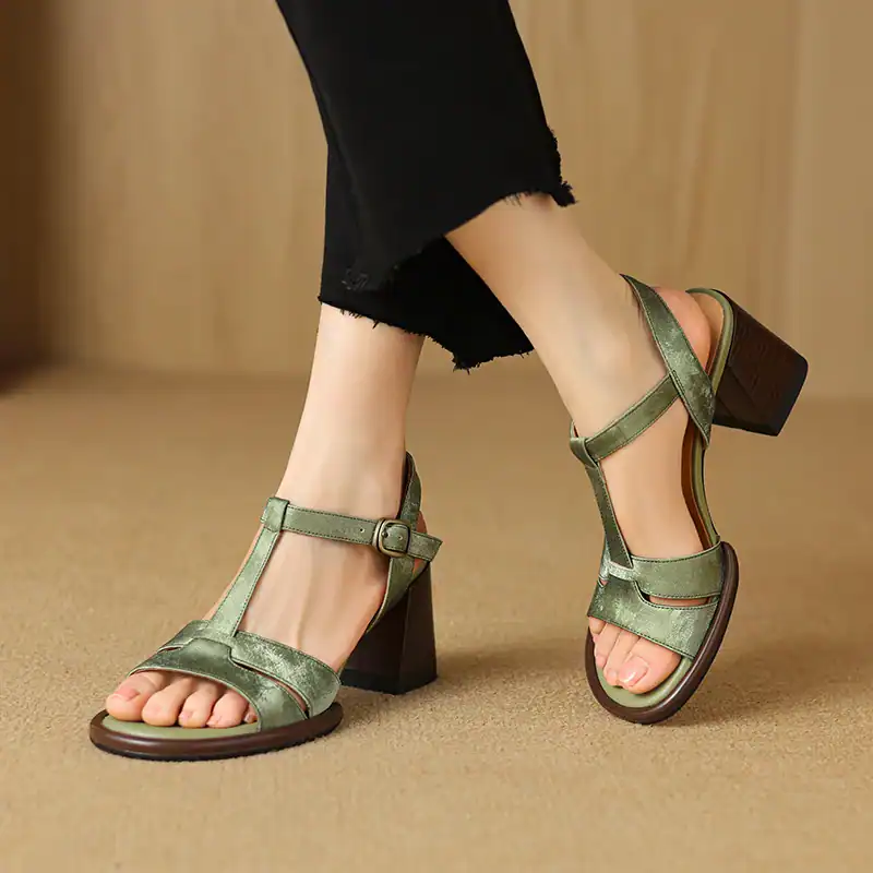 Stylish green open-toe sandals with ankle straps and chunky heels, perfect for summer and casual wear.