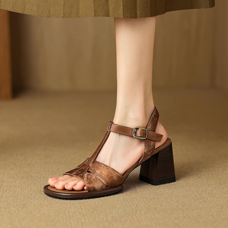Comfortable brown leather women’s sandals with ankle strap and chunky heel, perfect for casual or dressy occasions.