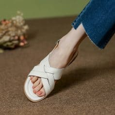 Comfortable white sandal with crisscross straps, perfect for casual or summer wear, available at Monalisa Store.