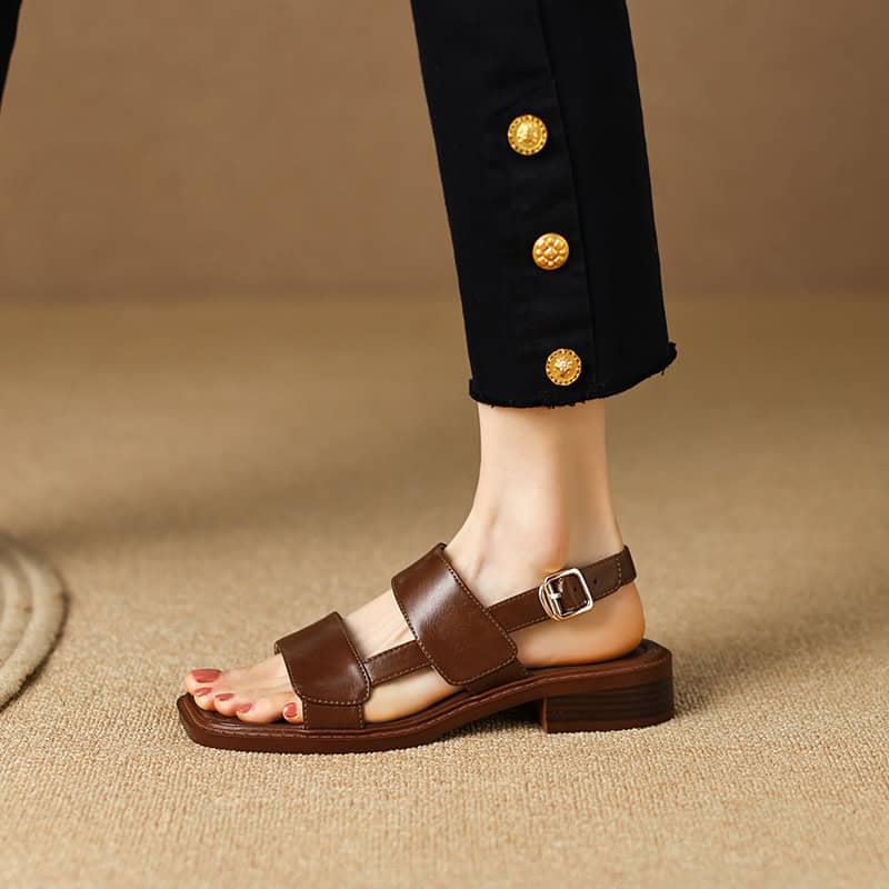 Elegant brown leather sandals with adjustable buckle, perfect for comfortable everyday wear and fashion-forward look.
