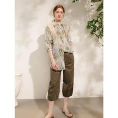 A trendy and comfortable casual women’s outfit featuring a printed shirt with brown pants, perfect for modern fashion and everyday wear.