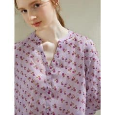 Beautiful young woman in floral pink blouse at Monalisa Medical Store.