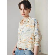 Elegant women's blouse featuring a unique watercolor print ideal for optometry professionals and eyewear boutiques. Perfect for a fashionable look in eyewear stores or optical clinics.