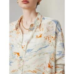 Stylish women's blouse featuring a vibrant floral pattern, perfect for fashion-forward and professional looks, suitable for office wear or casual outings.