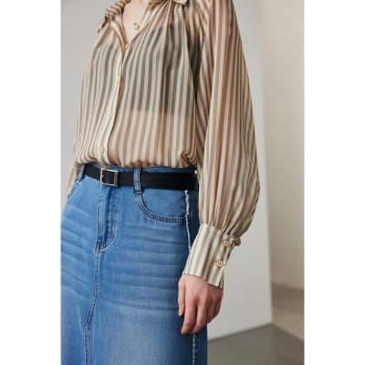 Elegant striped blouse for women, featuring puffed sleeves, buttoned cuffs, and trendy design, ideal for office or casual wear.