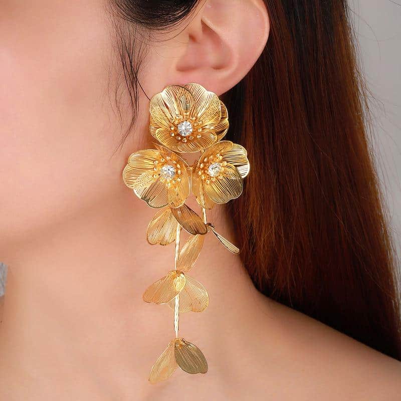 Gorgeous gold floral earrings featuring sparkling diamonds, perfect for luxury jewelry lovers. Shop unique and elegant designs at Monalisa Store for sophisticated fashion statements.