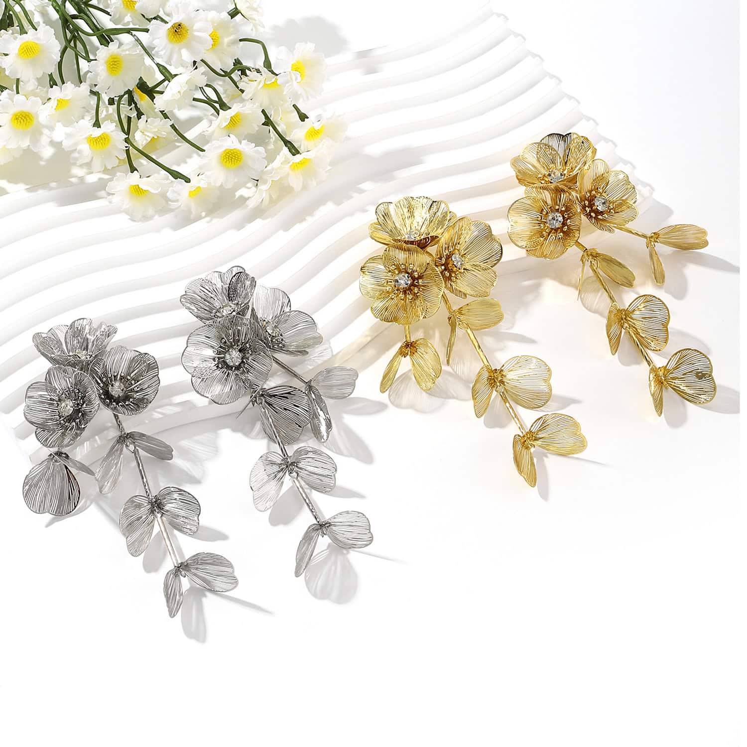 Bright and detailed floral jewelry pieces in silver and gold for stylish women.