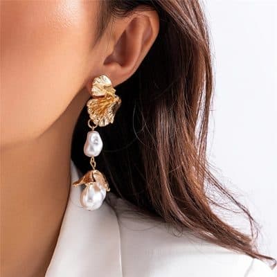 Gorgeous pearl earrings featuring gold floral design and dangling pearls, ideal for women’s jewelry collections, enhancing your elegant look.