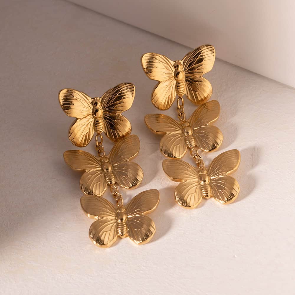 Elegant gold butterfly earrings featuring a dangling butterfly design, ideal for stylish accessories and enhancing your fashion statement.