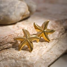 Stunning gold star earrings displayed at Monalisa Store, perfect for fashionable accessories and jewelry lovers seeking high-quality, stylish, and unique jewelry pieces.