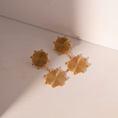 Stylish gold ear cuffs with intricate spiral and beaded design, perfect for fashionable men and women, enhancing your accessory collection.