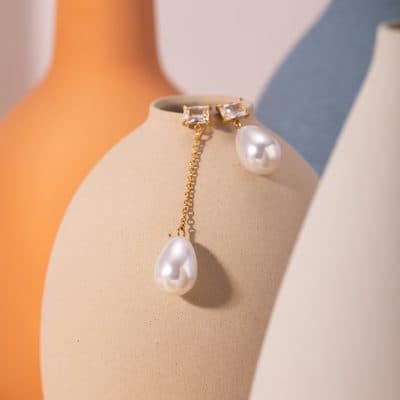 Luxurious pearl earrings with gold accents and a delicate chain, perfect for women seeking stylish and high-quality jewelry at Monalisa Medical.