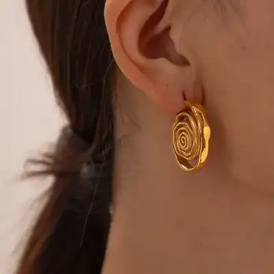 Gold spiral earrings, stylish jewelry, women's accessories, Monalisa Medical store, trendy gold earrings, luxury jewelry, fashionable earrings for women.