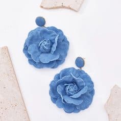 Stylish blue flower earrings featuring fabric petals, perfect for fashion-forward accessories and elegant look enhancements.