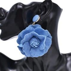Elegant fabric flower statement earring in vibrant blue, perfect for fashion-forward accessories and stylish occasions.