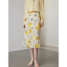 Stylish floral maxi skirt featuring yellow flower patterns, ideal for summer outfits, and versatile for casual or dressy looks.