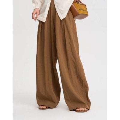 Stylish wide-leg brown pants for women, perfect for casual and office wear, made from comfortable lightweight fabric with a relaxed fit.