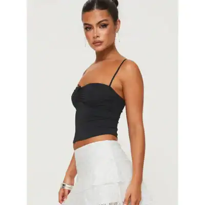 Elegant black camisole with delicate straps, perfect for fashionable summer or casual wear. Designed for comfort and style, ideal for pairing with skirts or jeans.