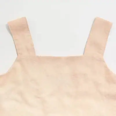 Elegant beige tank top for women, soft fabric, stylish and comfortable casual wear, perfect for summer or active days.