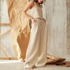 Stylish beige wide-leg pants from Monalisa Store with high waist and button details, ideal for casual and chic outfits. Perfect for women's fashion.