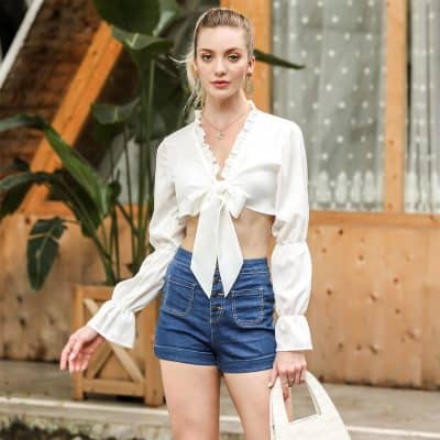 Elegant casual style with trendy crop top and denim shorts.