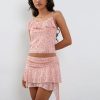 Pink floral summer outfit for women with ruffle accents and layered skirt, ideal for beach, casual or vacation wear.