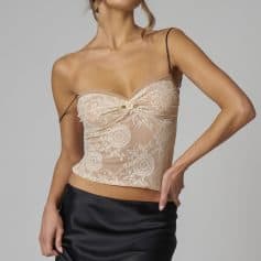 Luxurious lace lingerie top featuring delicate floral patterns, a satin bow with a rose embellishment, and adjustable thin straps for a beautiful and feminine look.