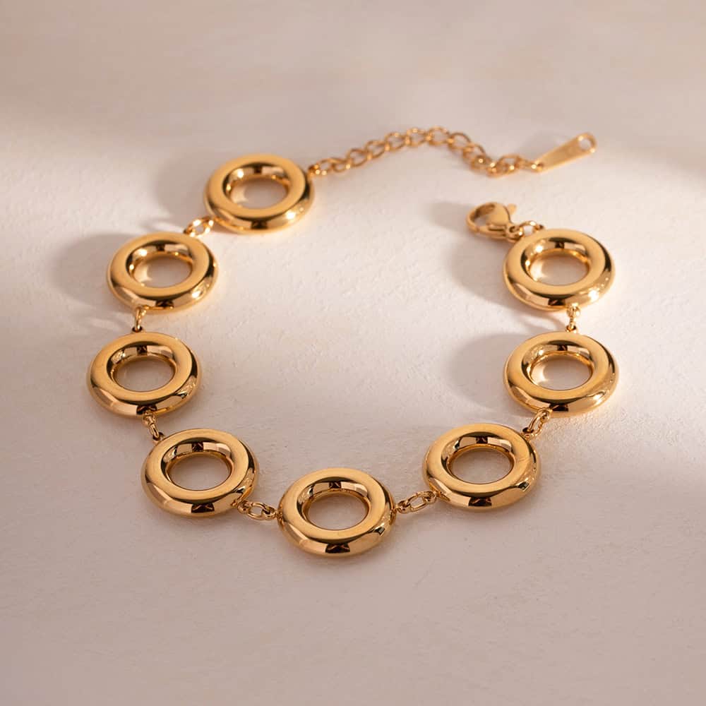 Glamorous gold jewelry necklace and bracelet set, crafted with high-quality materials. Ideal for fashion-forward individuals seeking trendy, sophisticated accessories. Available at Monalisa Store.