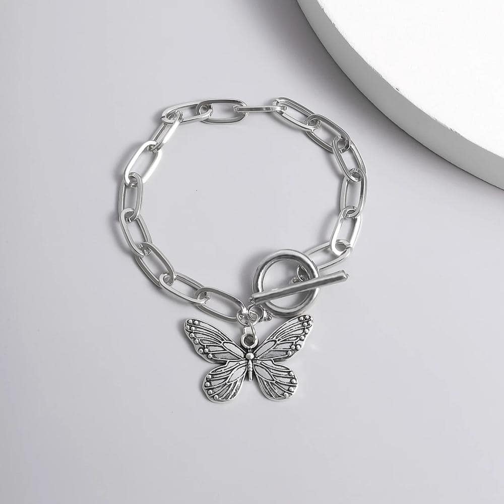 Sterling silver butterfly charm bracelet with bold chain links, perfect for women's fashion accessories and gift ideas.