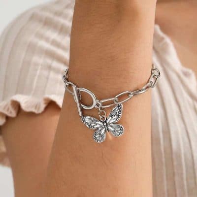 Elegant silver butterfly charm bracelet for women, trendy jewelry accessory, perfect for gifting and everyday wear.