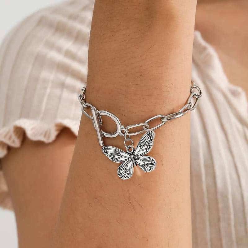 Elegant silver butterfly charm bracelet for women, trendy jewelry accessory, perfect for gifting and everyday wear.