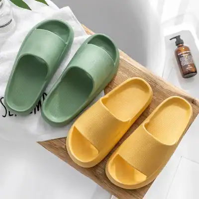 Colorful rubber indoor slippers, green and yellow, lightweight and comfortable for home wear or spa use. Perfect for casual lounging and easy to clean.