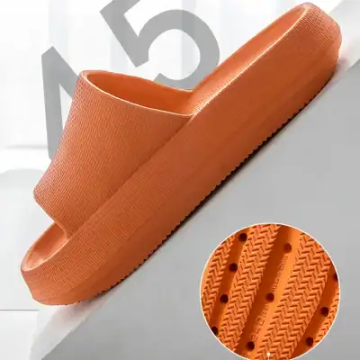 Durable orange slip-on shower sandal with textured sole for slip resistance, perfect for spa, pool, or bathroom use. Comfortable lightweight footwear ideal for wet environments.