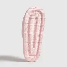 Soft pink slip-on slippers with textured soles for comfort and support. Perfect for indoor use, providing a cozy and stylish footwear option.