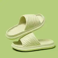 Comfortable green slide sandals with textured straps, lightweight and perfect for casual | summer outdoor activities, fashionable and easy-to-wear women's footwear.
