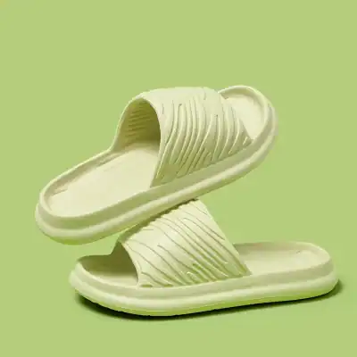 Comfortable green slide sandals with textured straps, lightweight and perfect for casual | summer outdoor activities, fashionable and easy-to-wear women's footwear.