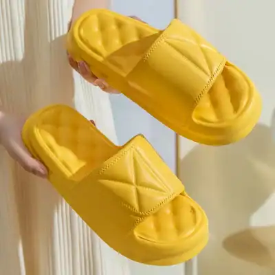 Bright yellow slide slippers with cushioned footbeds, perfect for casual wear and everyday comfort. Stylish slide sandals ideal for summer, indoor, and outdoor activities.